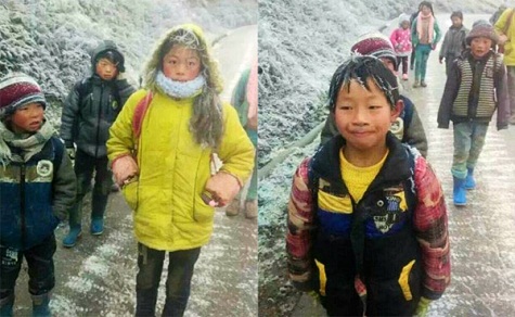 Các em nhỏ mặc không đủ ấm, tóc bị đóng băng và mặt mũi đỏ ửng lên.